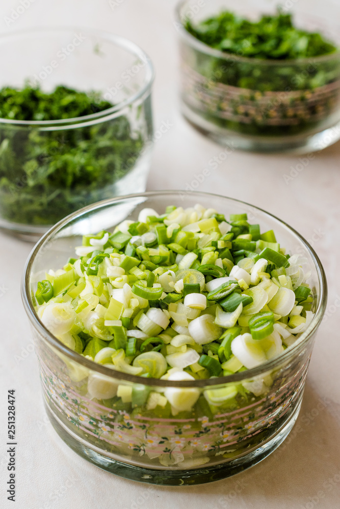 Chopped Chives, Parsley and Dill in Glass Bowls. Chopped Chives, Parsley and Dill in Glass Bowls.