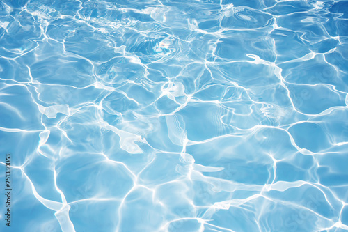 Texture of water in swimming pool for background