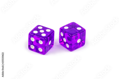 Two purple glass dice isolated on white background. Five and two.