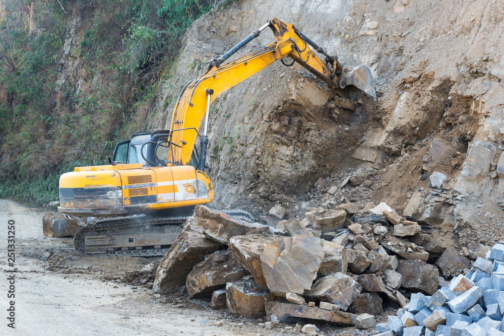 Road widening using earth excavating machinery Road widening using earth excavating machinery