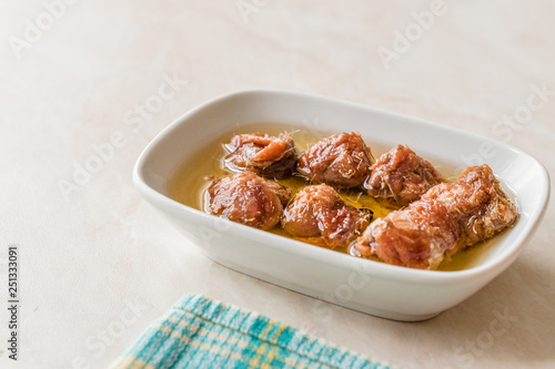 Marinated Canned Anchovy Fillet in Bowl / Anchovies served with Black Pepper on Marble Board.
