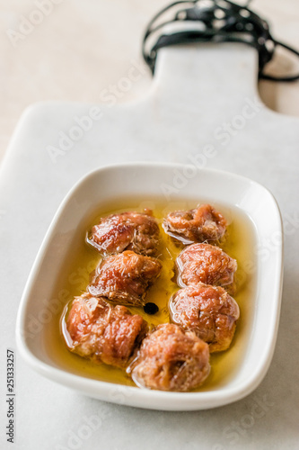 Marinated Canned Anchovy Fillet in Bowl / Anchovies served with Black Pepper on Marble Board.