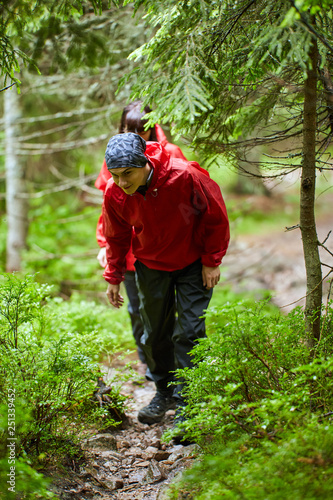 People in raincoats hiking