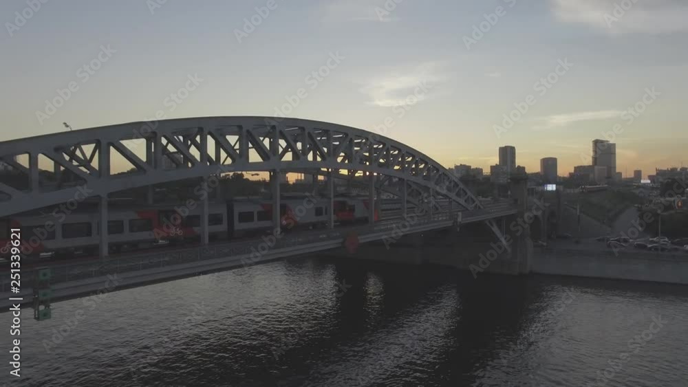 Aerial View of Moscow train on the bridge, sunset Aerial View of Moscow train on the bridge, sunset