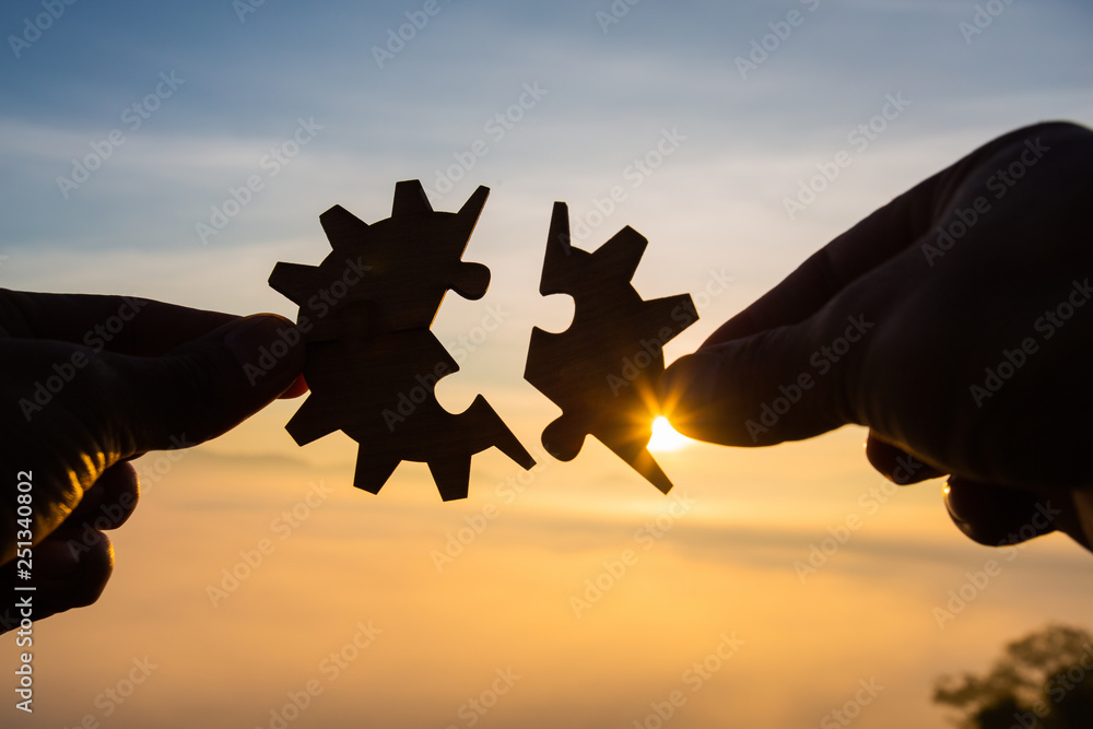 Silhouette Woman hands connecting couple puzzle piece against sunrise, Business solutions, target, success, goals and strategy concepts - obrazy, fototapety, plakaty 