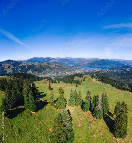 Aerial view of Ceahlau and lake Lzvorul Muntelui, Romania. Travel and vacation concept, forest and mountains, camping. summer day, square photo