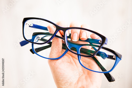 Two glasses in the blue frame in hand