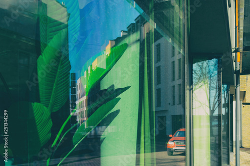 The reflection of the city buildings in the window