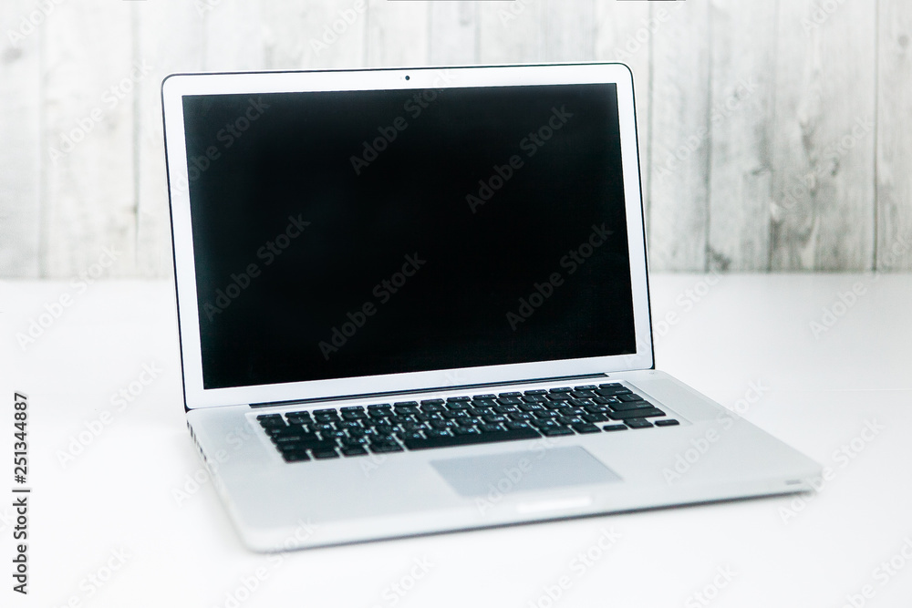 Opened laptop on a white ground Opened laptop on a white ground