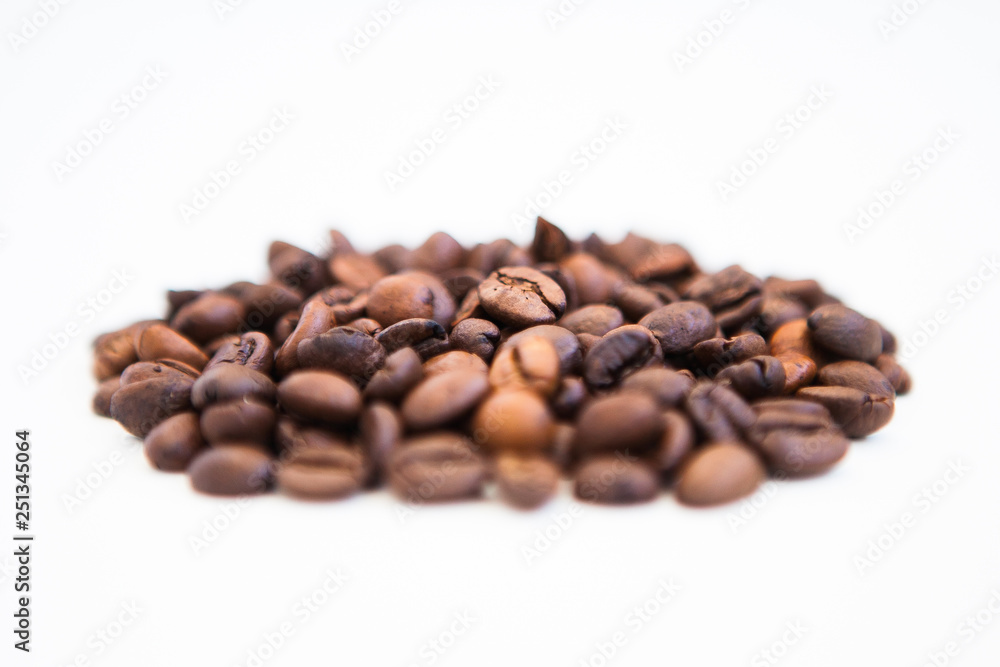 Coffee beans on a white ground, close up Coffee beans on a white ground, close up