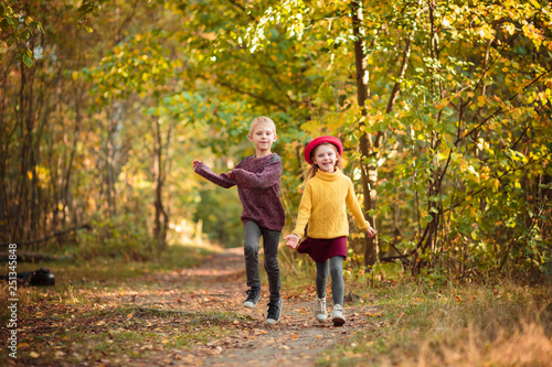 children run in the park in autumn © Евгения Янцева
