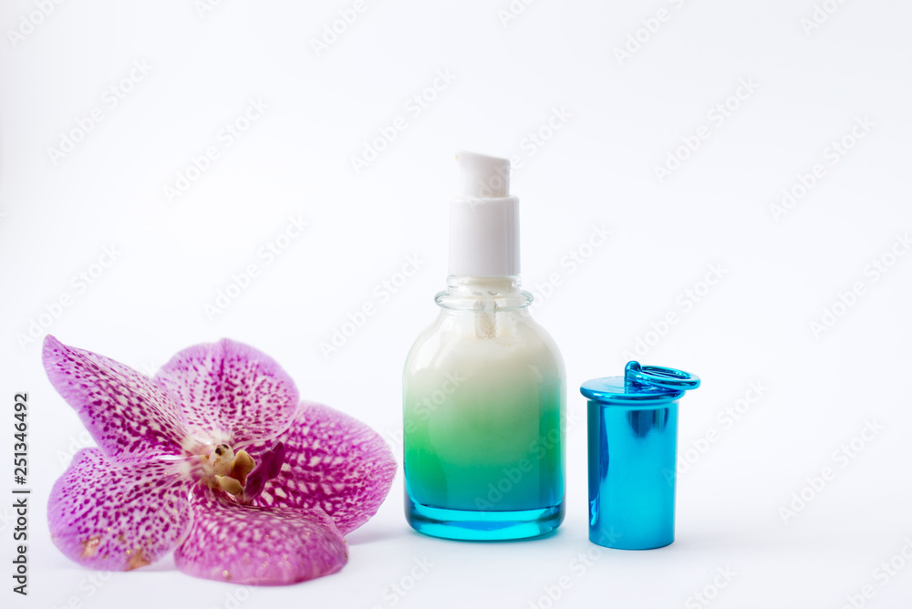 Jar of cream and pink flower on white background, top view. Professional cosmetic products Jar of cream and pink flower on white background, top view. Professional cosmetic products