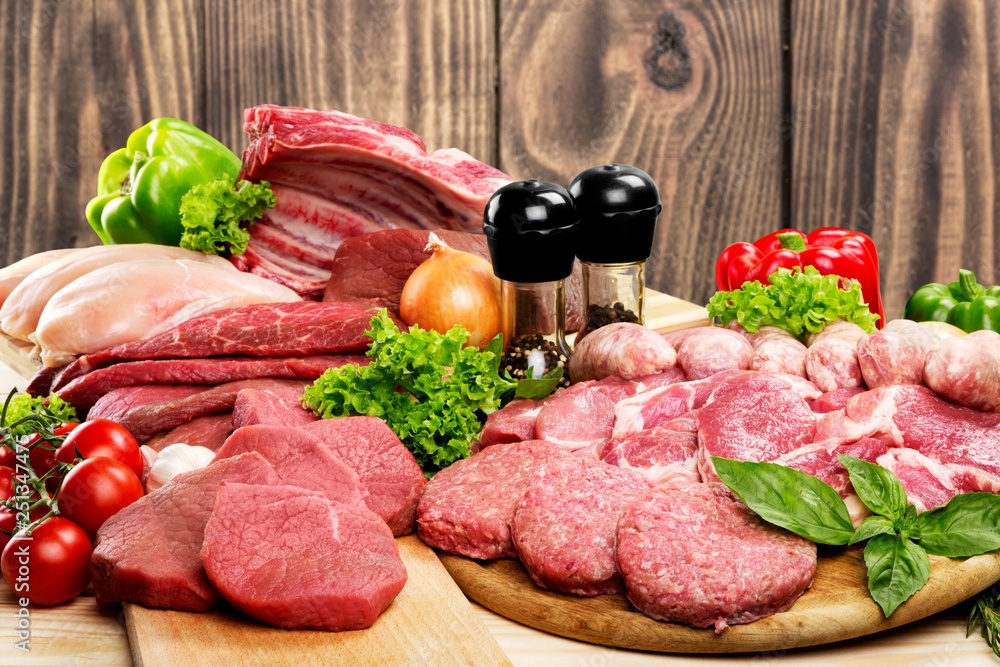 Fresh Raw Meat Background with vegetables Fresh Raw Meat Background with vegetables