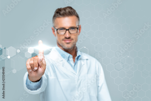 selective focus of handsome scientist touching interface in air isolated on white, artificial intelligence concept