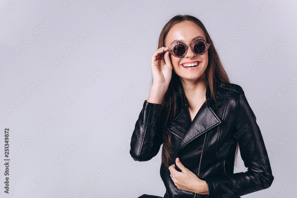 Beautiful smart serious fashionable professional model posing in studio. Business, fashion, beauty concept Beautiful smart serious fashionable professional model posing in studio. Business, fashion, beauty concept