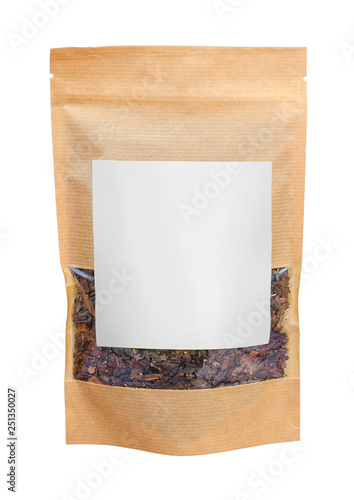 Craft paper pouch bag with herbal tea isolated on white background. Packaging template mockup. Front view