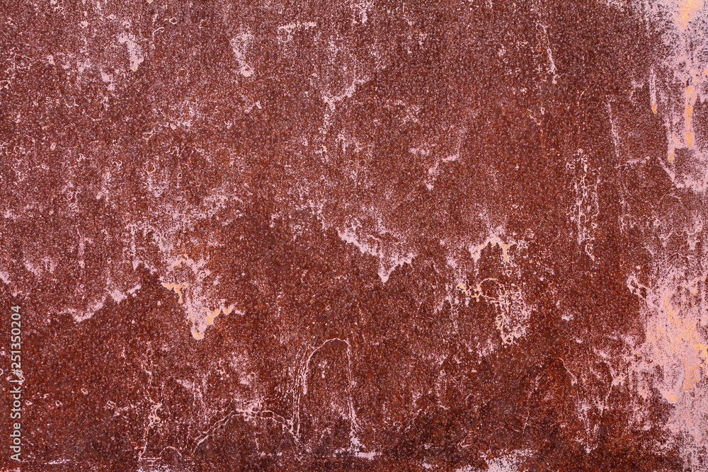 Fototapeta premium Old painted metal surface. Rusty metal, peeling paint, red tones. Worn metallic iron panel.