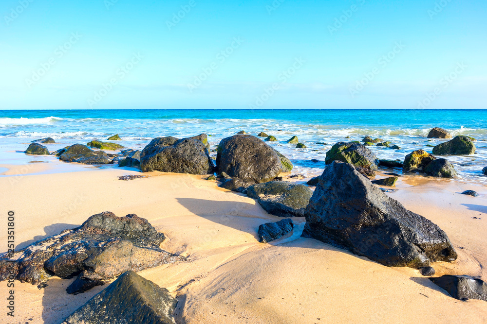 Stones on sandy beach