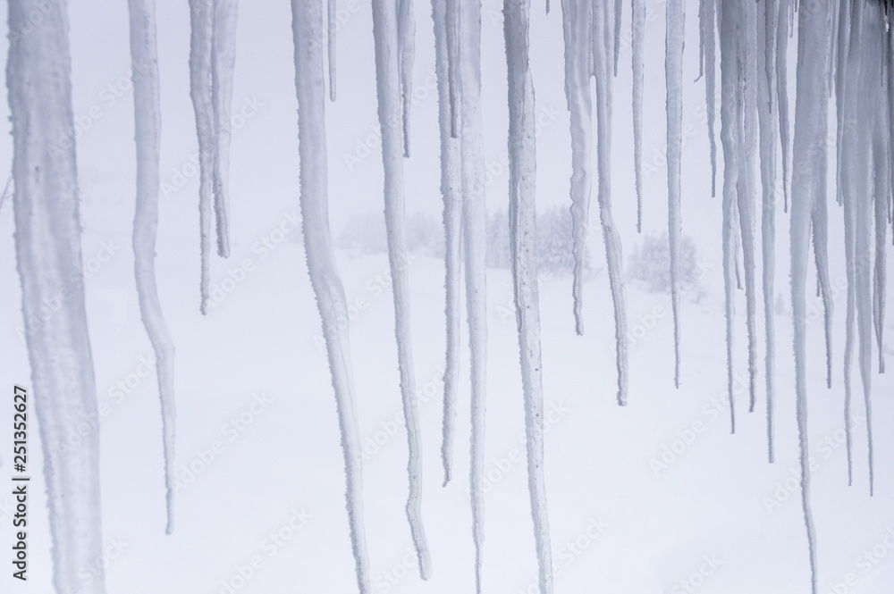 Looking outside thru icicles and the snow. Looking outside thru icicles and the snow.