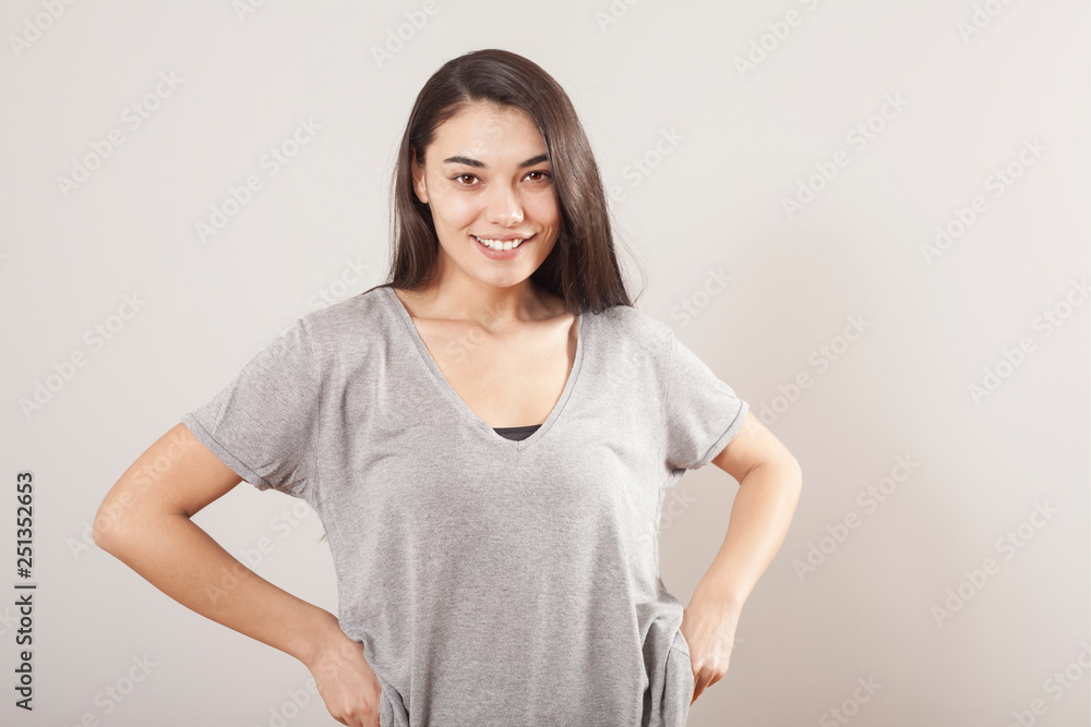 Young beautiful portrait woman on gray background Young beautiful portrait woman on gray background