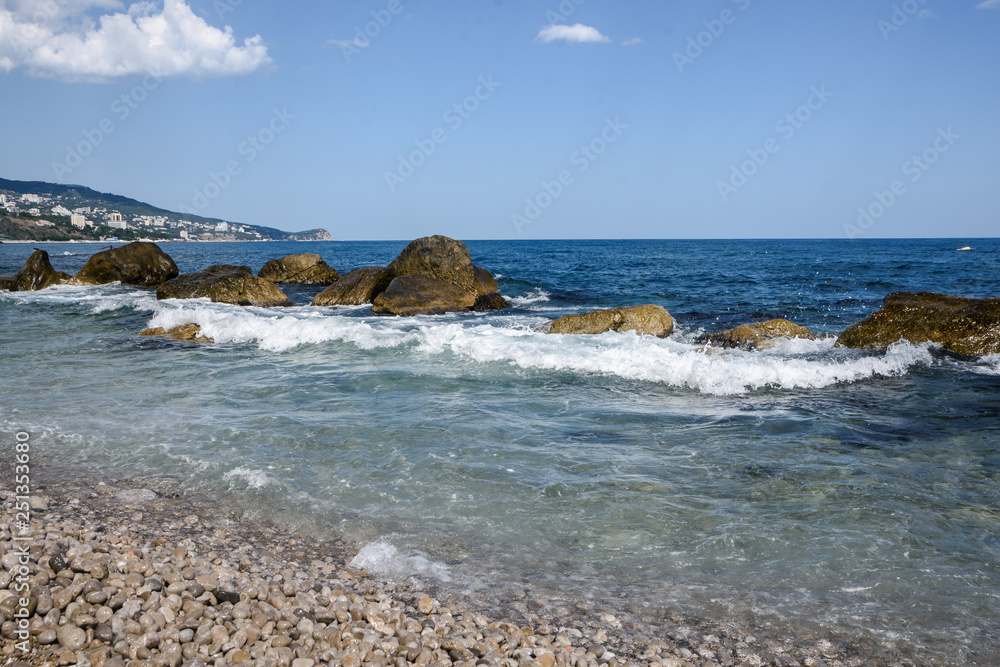 Sea waves, beating on the stones. Noisy sea. Coast of the Black Sea