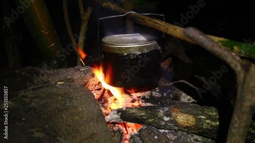 Cook ricewith a pitcher   in a natural way}at the forest in Thailand photo