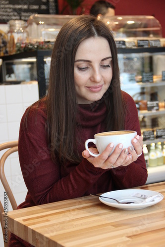 young woman with cup of coffee