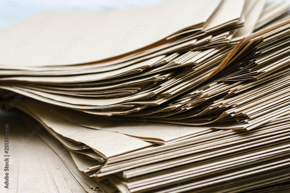 Side View Of Huge Stack of Recycled Paper close up. Business concept. Huge Stack of Recycled Paper envelopes closeup. Side View Of Huge Stack of Recycled Paper close up. Business concept. Huge Stack of Recycled Paper envelopes closeup.