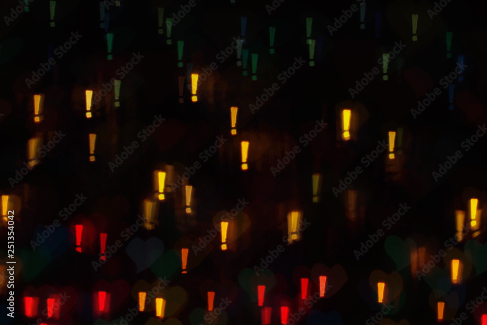 Colorful exclamation marks on dark background, with exclamation mark