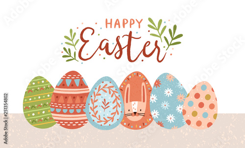 Postcard template with Happy Easter lettering handwritten with calligraphic script and colorful decorated eggs on white background