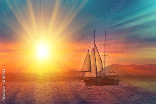 Old ancient ship on peaceful ocean at sunset. Calm waves reflection, sun setting. Copy space © Shcherbyna