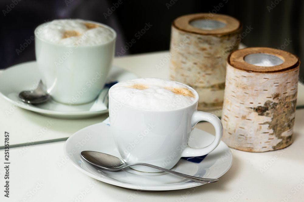 Cup of cappuccino reflecting in mirror Cup of cappuccino reflecting in mirror