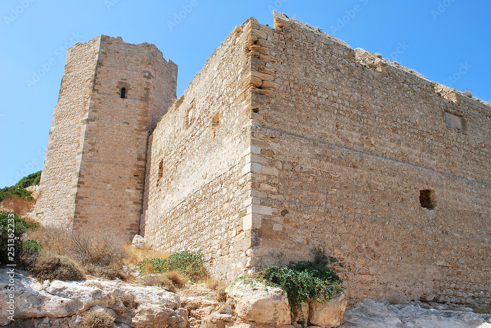 Close-up of stone ruins of walls and tower of Kritinia Castle, Kritinia Village, Rhodes Island, Greece