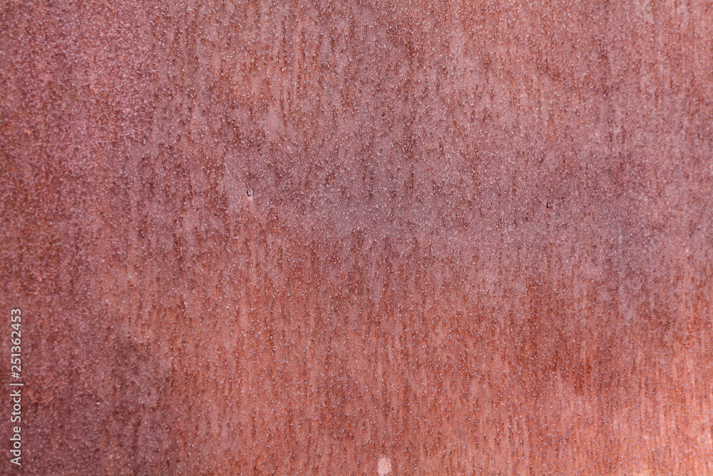 Fototapeta premium Old painted metal surface. Rusty metal, peeling paint, red tones. Worn metallic iron panel.
