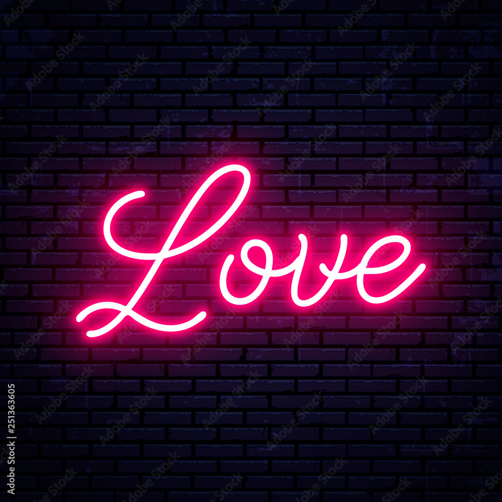 Neon inscription Love on the background of the wall.