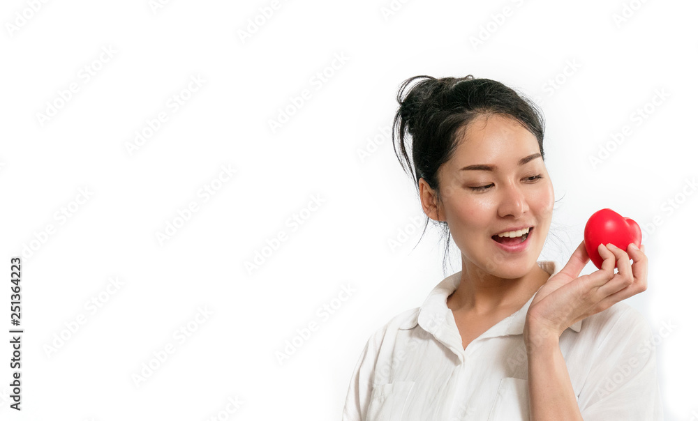 Beautiful young asian girl in casual colthes holding a red heart standing on a white background.Healthy and woman concept. Beautiful young asian girl in casual colthes holding a red heart standing on a white background.Healthy and woman concept.