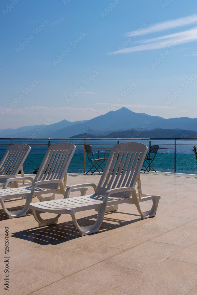 pool chairs overlooking ocean