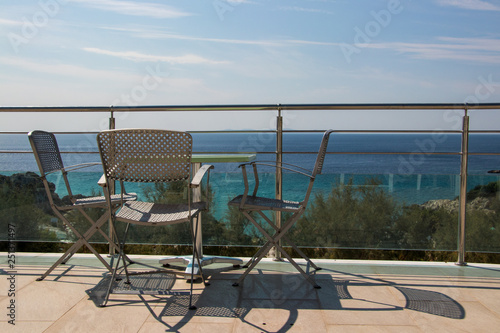 chairs and table overlooking ocean