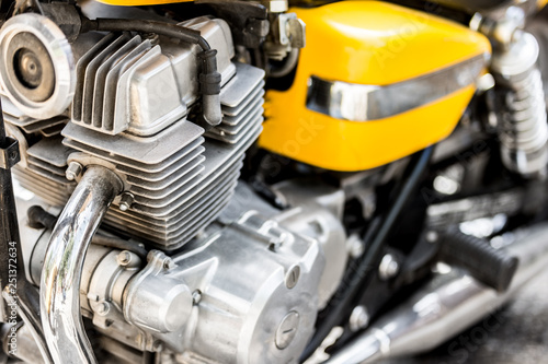 Closeup of motorcycle chasis and motor on yellow crotch rocket