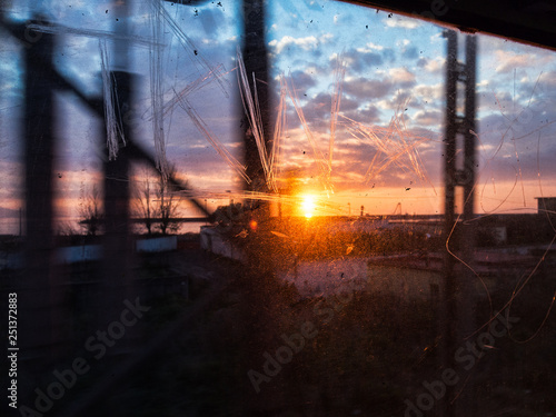 Obraz na plátně Sunset seen from the train 2