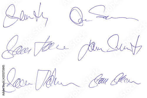 Handwritten signatures concept of signed document with ballpoint pen isolated on white background of matt photographic paper