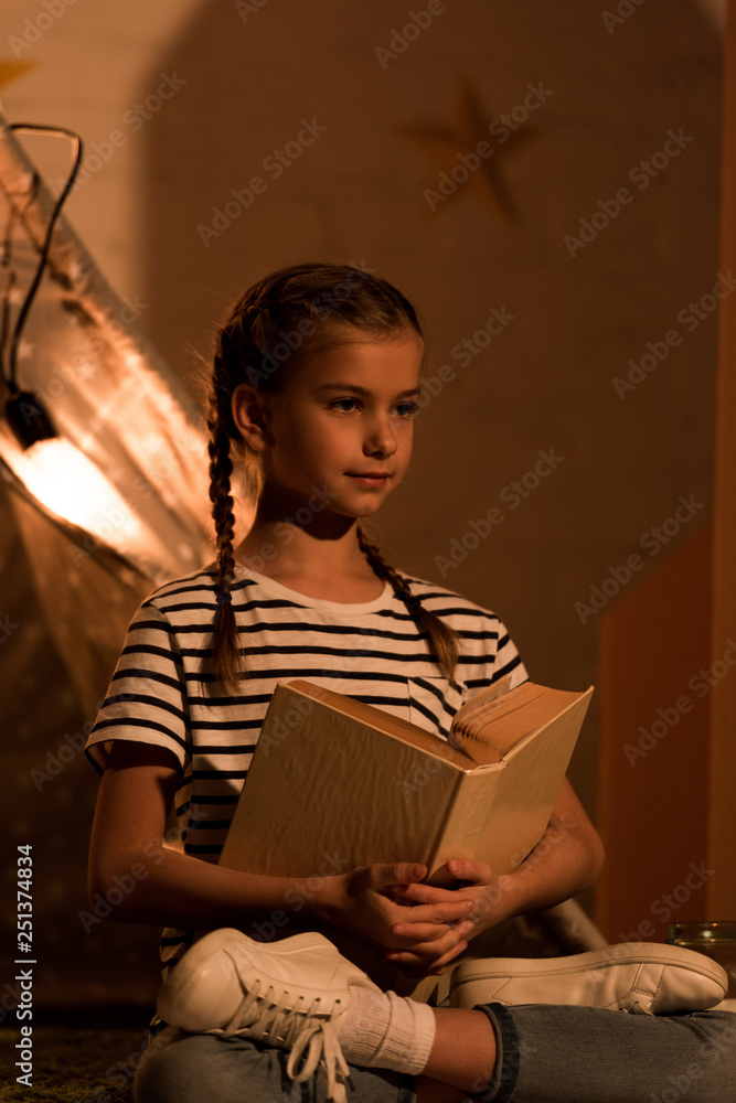 Portrait Of A Young Woman Relaxing And Reading In Her Downtown Los Angeles  Apartment Stock Photo - Download Image Now - iStock