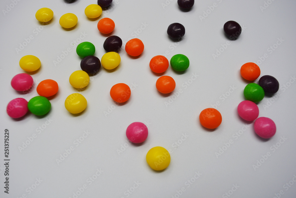 A lot of round sweets like tablets, medicine with bright color and taste. This color sweets are round beads, rainbow color stones. It's popular delicious colorful sweet with sweaty and lively form. A lot of round sweets like tablets, medicine with bright color and taste. This color sweets are round beads, rainbow color stones. It's popular delicious colorful sweet with sweaty and lively form.