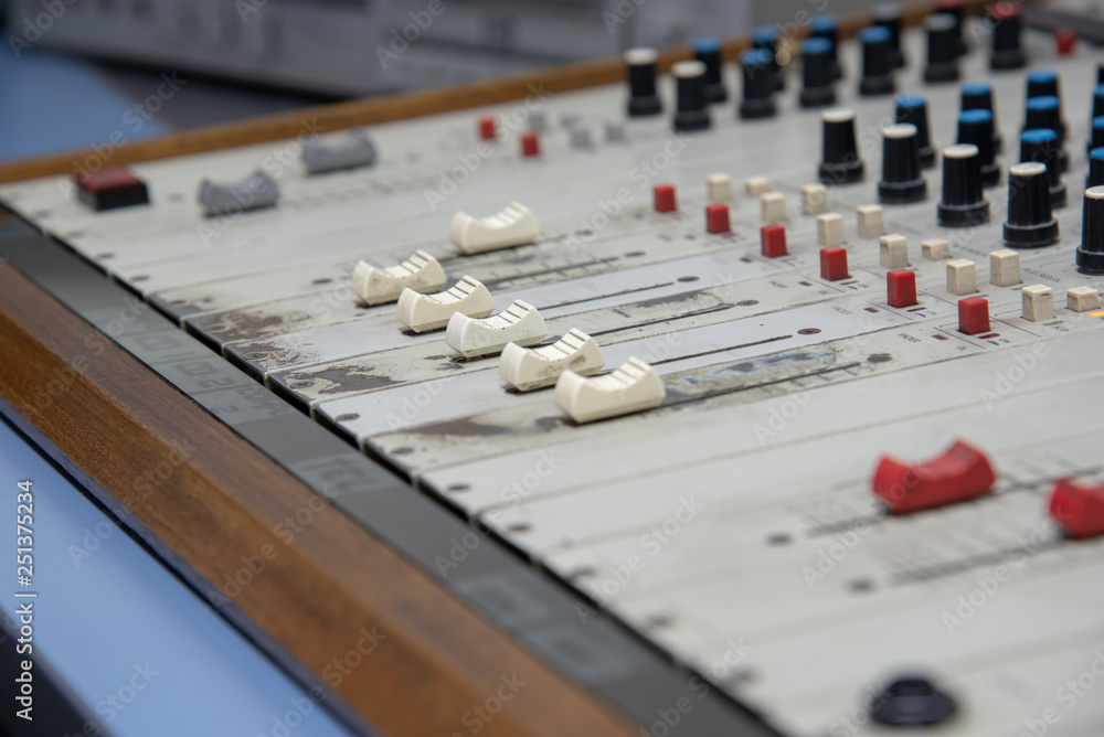 Antique radio mixer with faders, mixers, equalizers, pan-balance and the air button Antique radio mixer with faders, mixers, equalizers, pan-balance and the air button