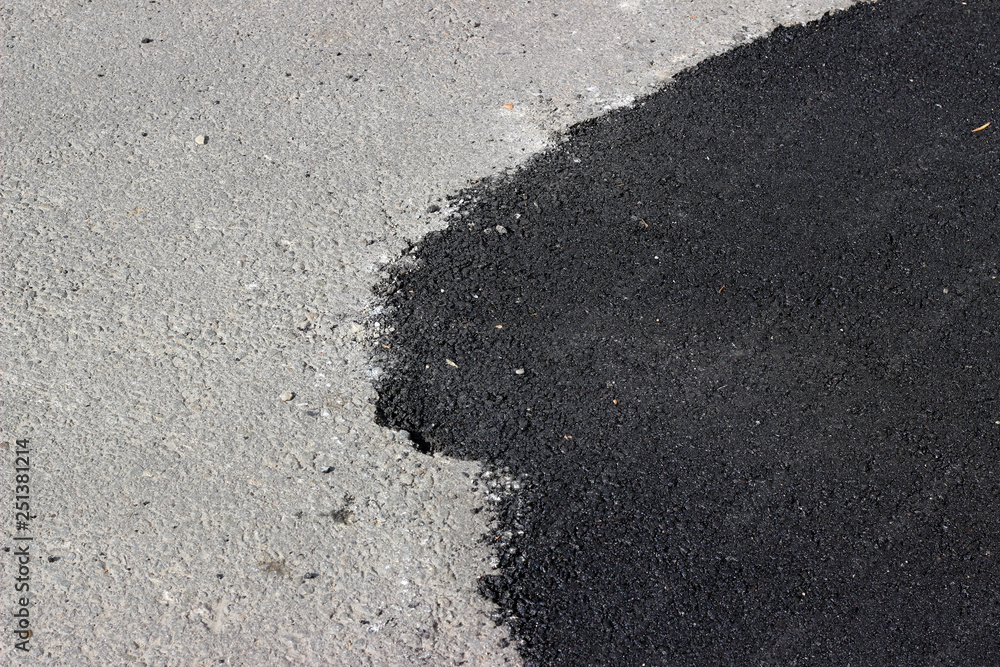 New and old asphalt surface patch city street New and old asphalt surface patch city street