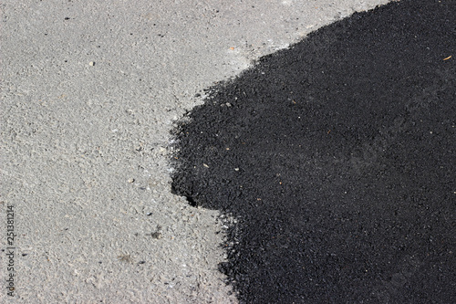 New and old asphalt surface patch city street