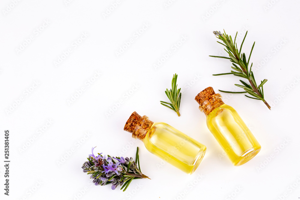 Fototapeta premium Rosemary essential oil in a small bottle. Natural aroma cosmetic oil