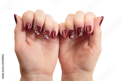 Female hands with manicure on a white background