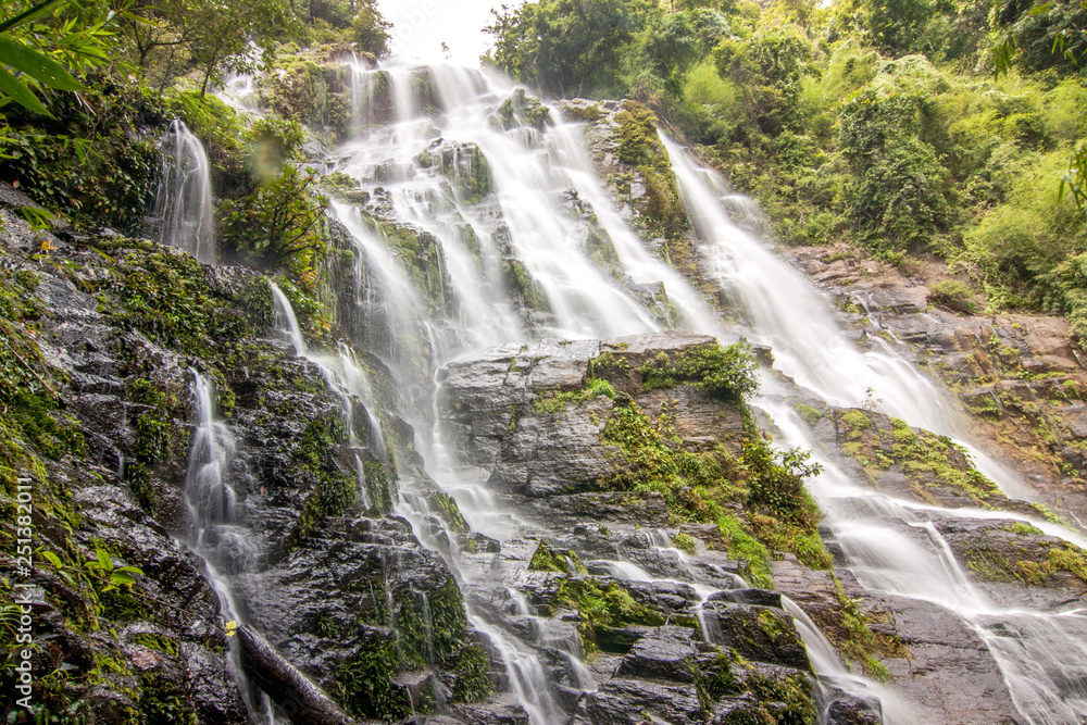Beautiful waterfalls and fine mist in the forest in Thailand Beautiful waterfalls and fine mist in the forest in Thailand