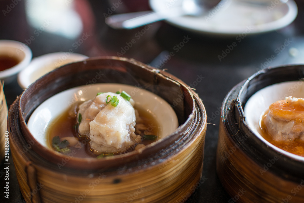 Chinese dim sum in a bamboo steamer box Chinese dim sum in a bamboo steamer box